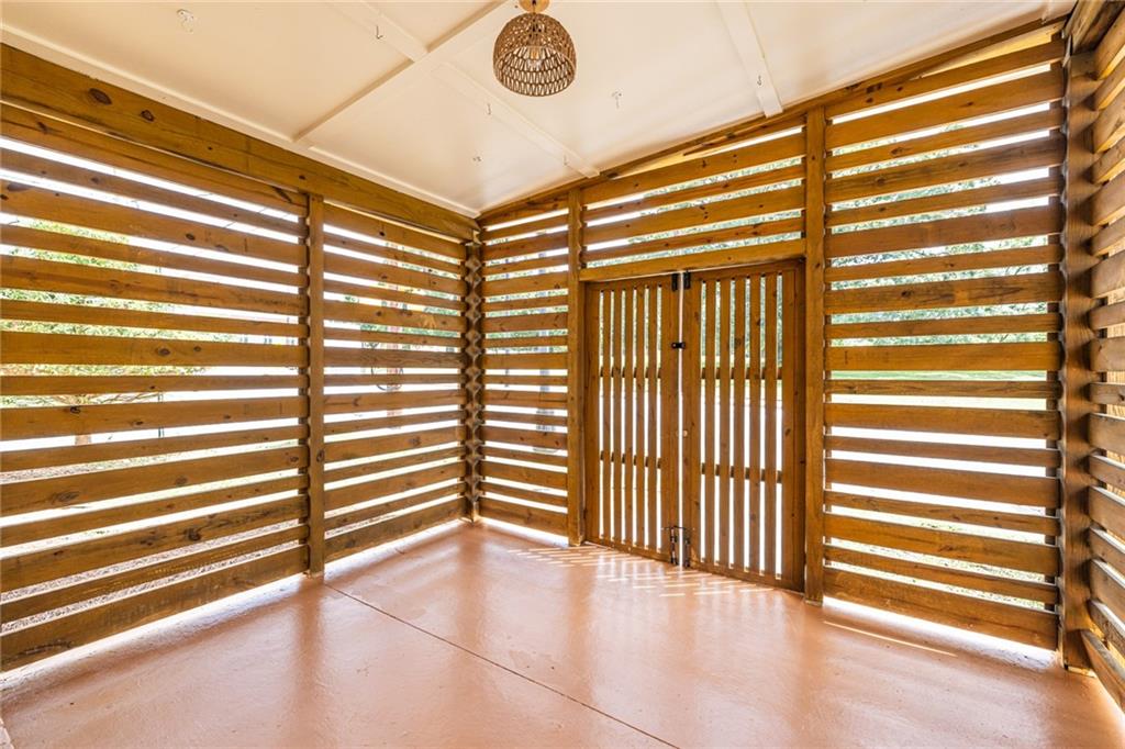 1651 Pryor Road Southwest Atlanta, GA 30315 - Photo 12 of 50 a view of empty room with wooden floor and fan