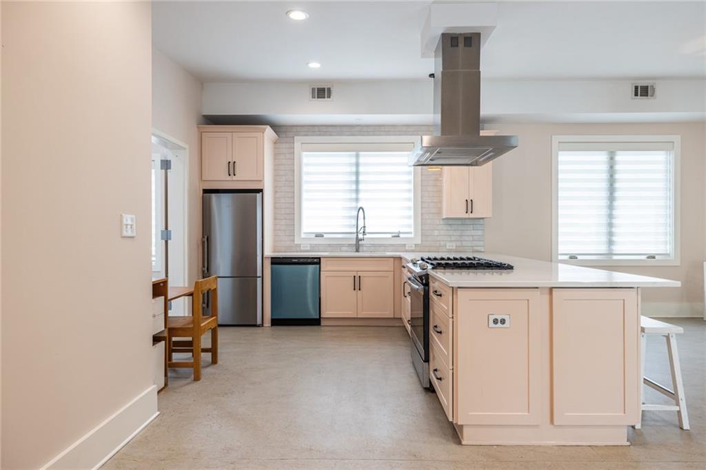 1651 Pryor Road Southwest Atlanta, GA 30315 - Photo 24 of 50 a kitchen with stainless steel appliances granite countertop a stove a sink and a refrigerator