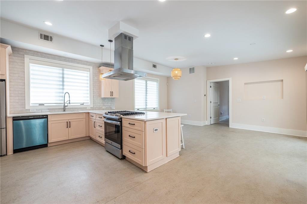 1651 Pryor Road Southwest Atlanta, GA 30315 - Photo 25 of 50 a kitchen with granite countertop white cabinets and white stainless steel appliances