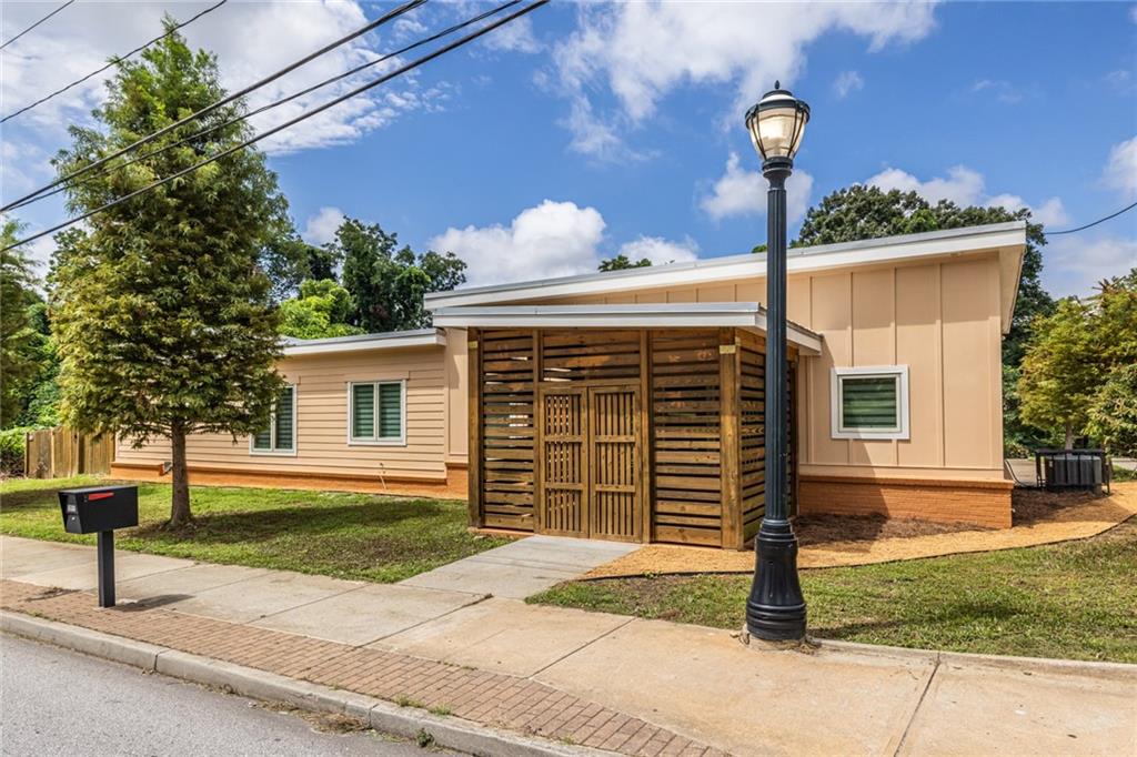 1651 Pryor Road Southwest Atlanta, GA 30315 - Photo 3 of 50 a front view of a house with garden