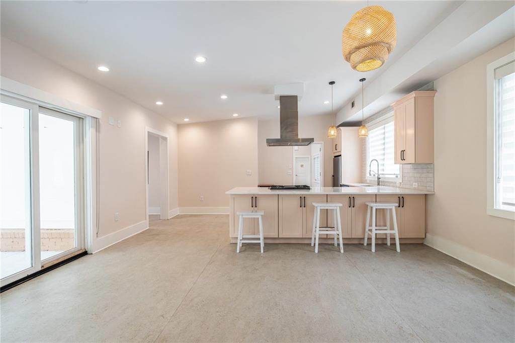 1651 Pryor Road Southwest Atlanta, GA 30315 - Photo 31 of 50 a large kitchen with a table and chairs