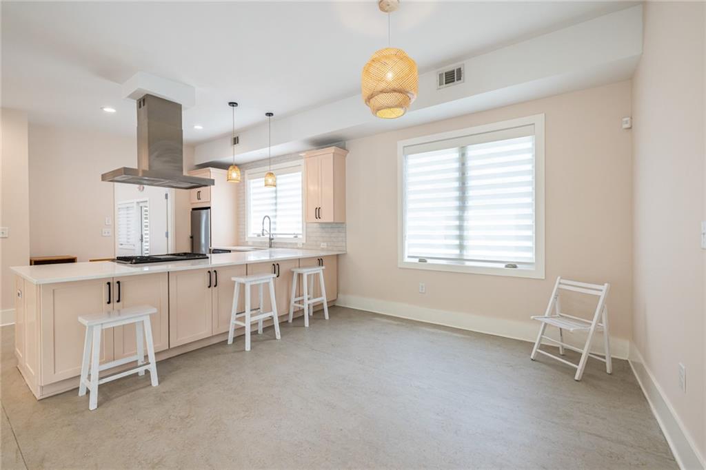 1651 Pryor Road Southwest Atlanta, GA 30315 - Photo 32 of 50 a large kitchen with a table and chairs