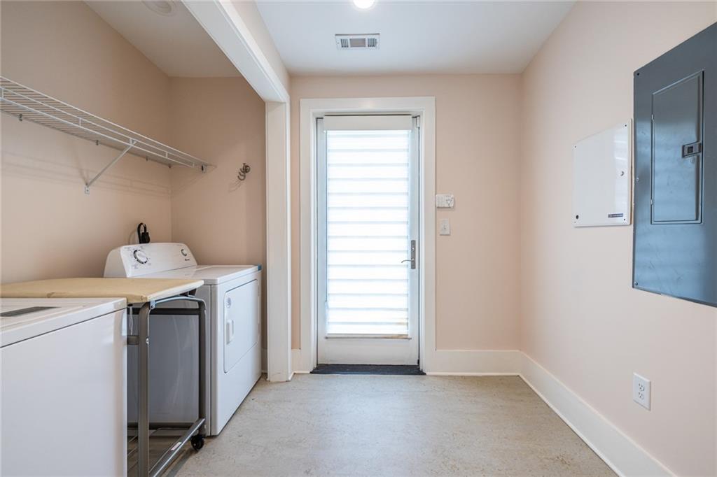 1651 Pryor Road Southwest Atlanta, GA 30315 - Photo 34 of 50 a utility room with dryer and washer