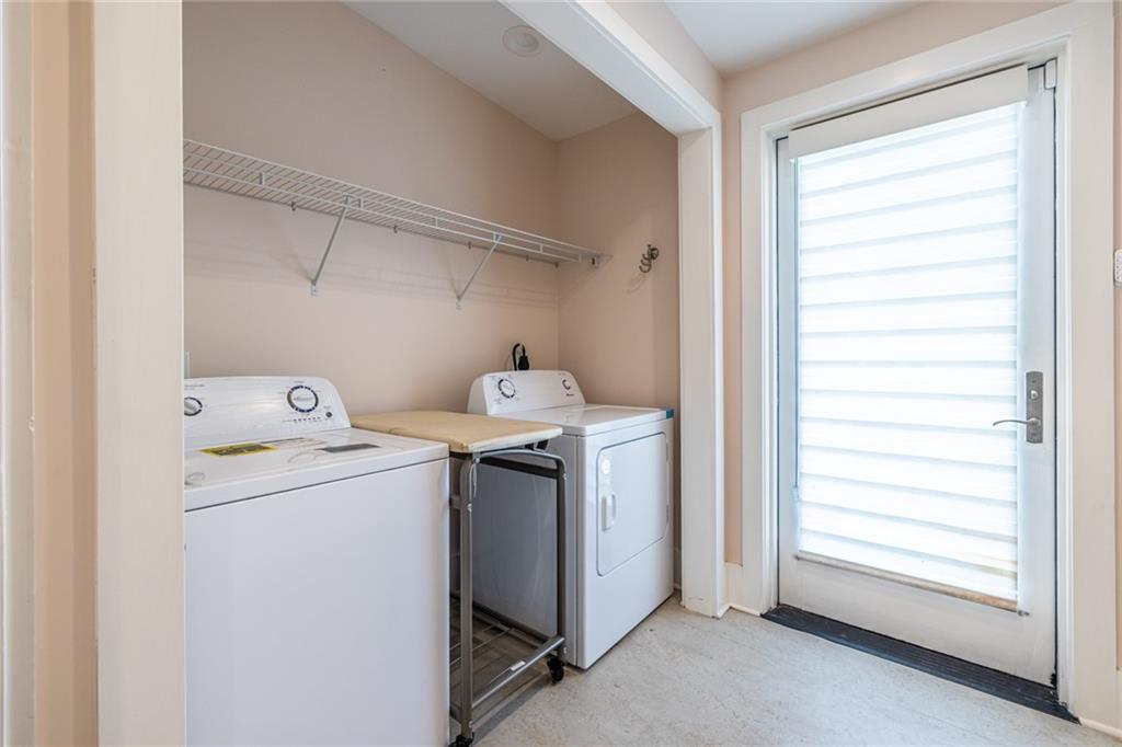 1651 Pryor Road Southwest Atlanta, GA 30315 - Photo 35 of 50 a utility room with dryer and washer