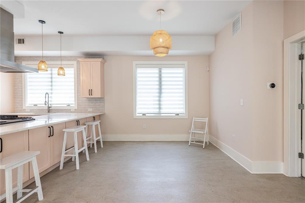 1651 Pryor Road Southwest Atlanta, GA 30315 - Photo 36 of 50 a large white kitchen with a window