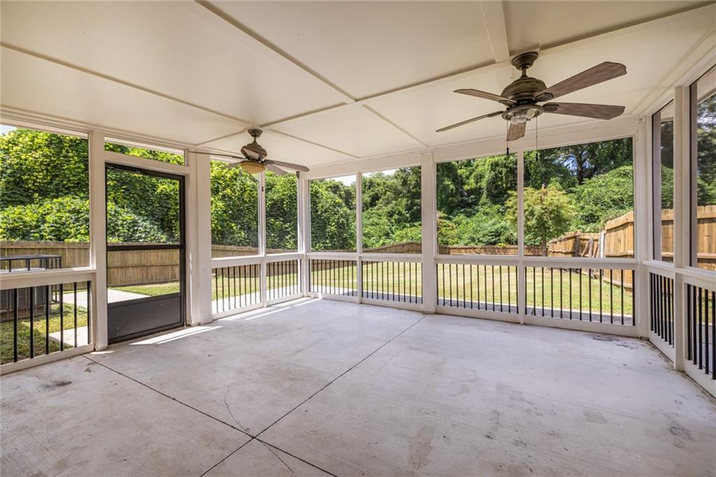 1651 Pryor Road Southwest Atlanta, GA 30315 - Photo 37 of 50 a view of a room with a ceiling fan and floor to ceiling window
