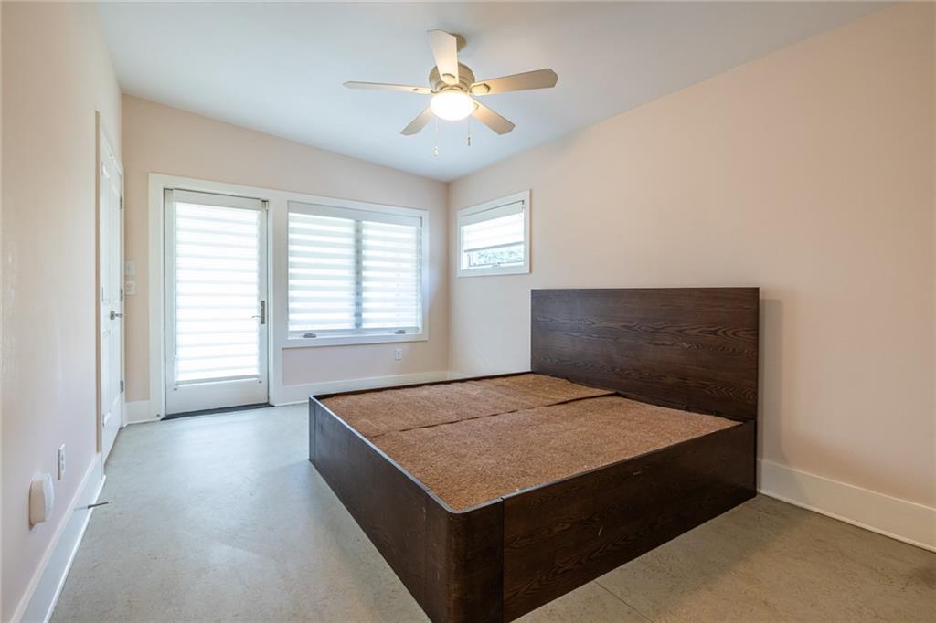 1651 Pryor Road Southwest Atlanta, GA 30315 - Photo 40 of 50 a living room with a bed furniture and a chandelier