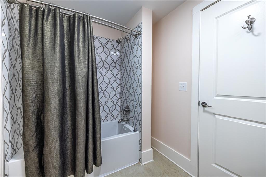 1651 Pryor Road Southwest Atlanta, GA 30315 - Photo 46 of 50 a bathroom with a bathtub and shower