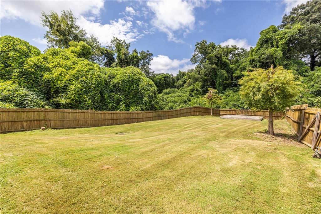 1651 Pryor Road Southwest Atlanta, GA 30315 - Photo 7 of 50 a view of a swimming pool with an outdoor space and seating area