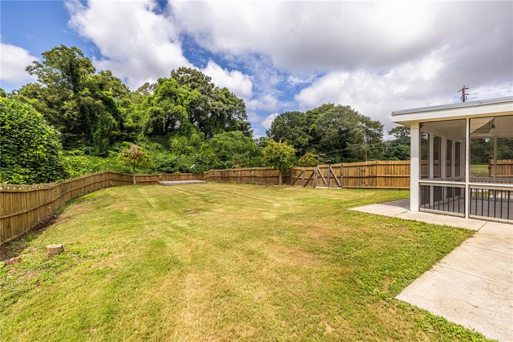 1651 Pryor Road Southwest Atlanta, GA 30315 - Photo 9 of 50 a view of a swimming pool with an outdoor space and seating area