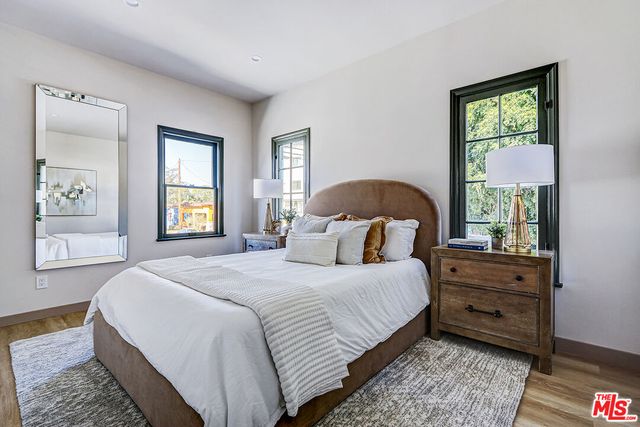 a bedroom with bed and a window