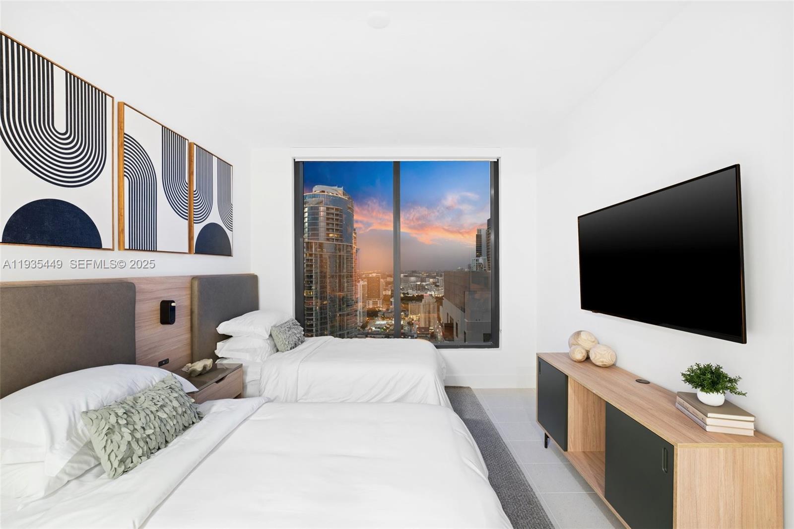 159 Northeast 6th Street, Unit 4415 Miami, FL 33132 - Photo 12 of 47 a living room with furniture and a flat screen tv