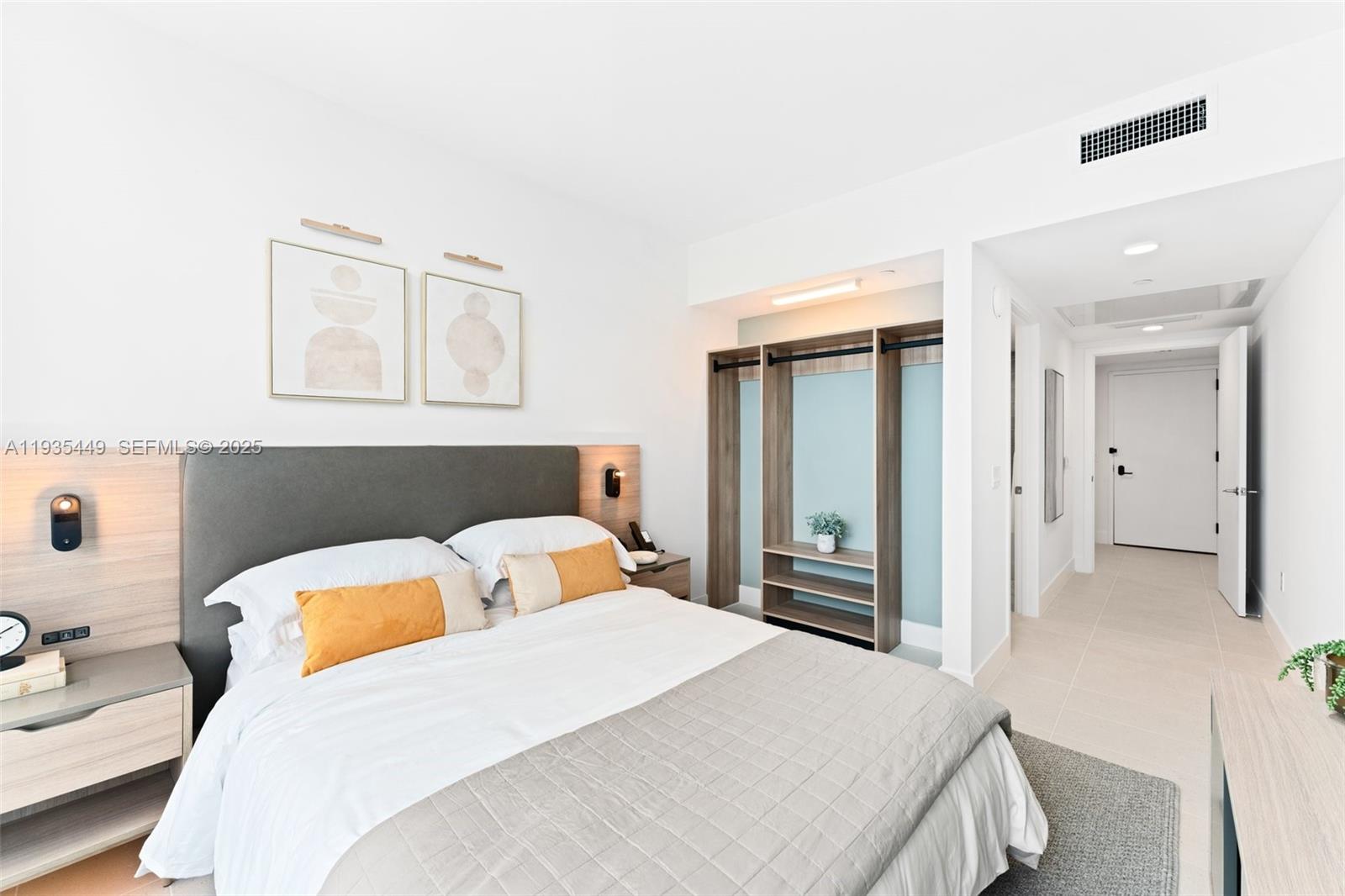 159 Northeast 6th Street, Unit 4415 Miami, FL 33132 - Photo 15 of 47 a bedroom with a bed and closet