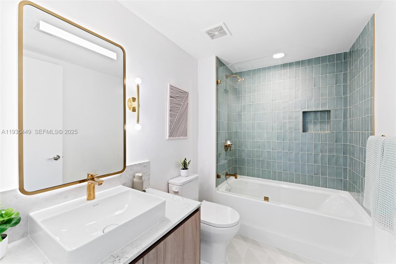 159 Northeast 6th Street, Unit 4415 Miami, FL 33132 - Photo 19 of 47 a bathroom with a sink mirror toilet and bathtub