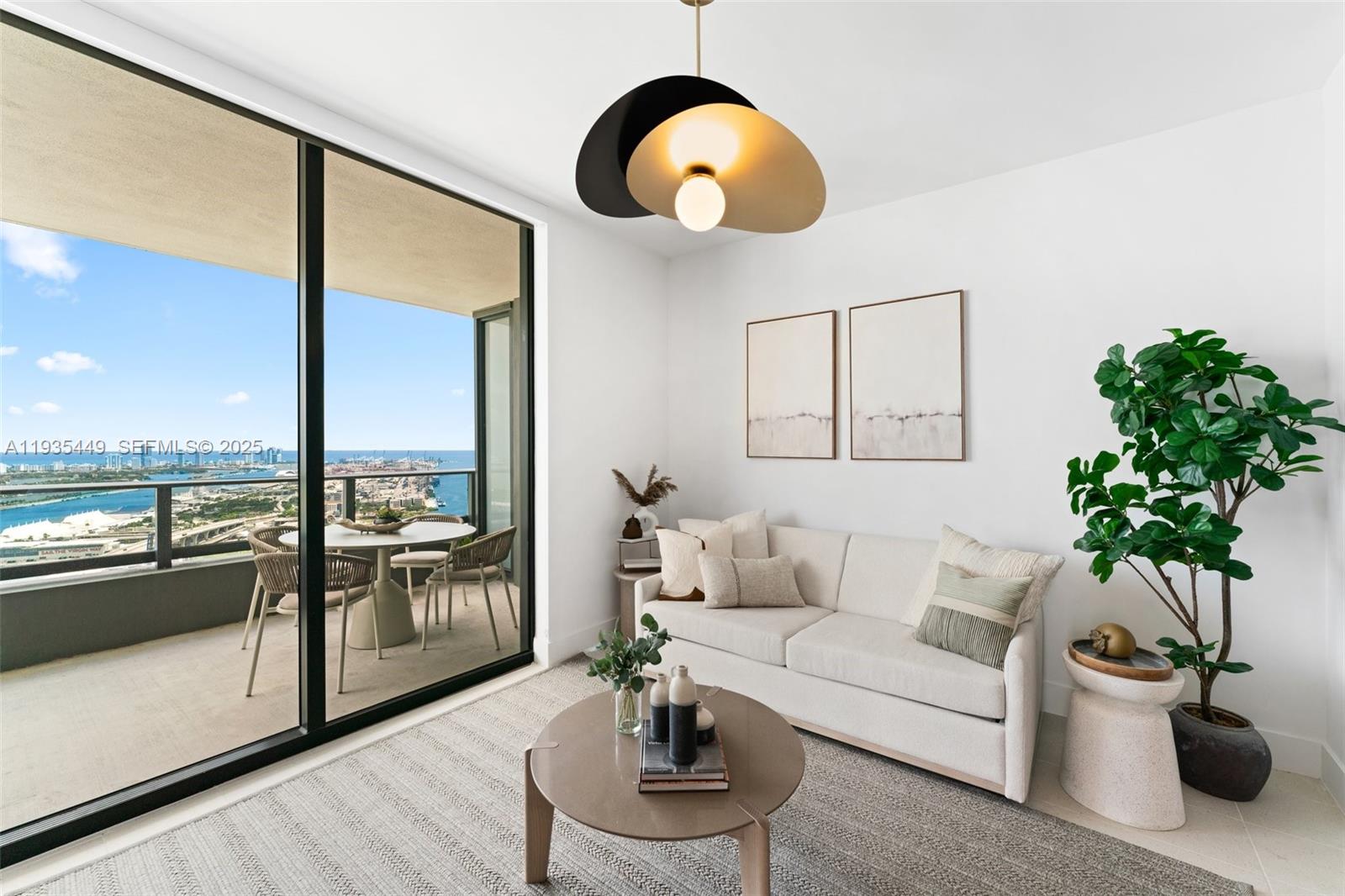159 Northeast 6th Street, Unit 4415 Miami, FL 33132 - Photo 21 of 47 a living room with furniture potted plant and a large window
