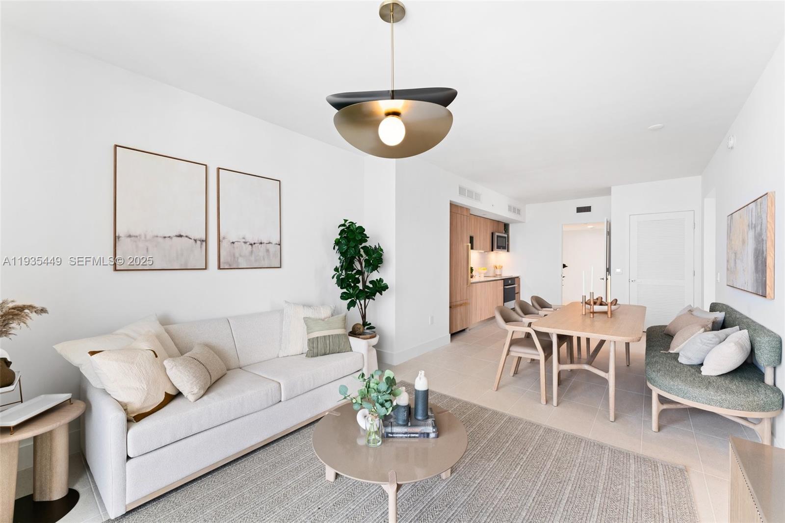 159 Northeast 6th Street, Unit 4415 Miami, FL 33132 - Photo 23 of 47 a living room with furniture a dining table and a potted plant
