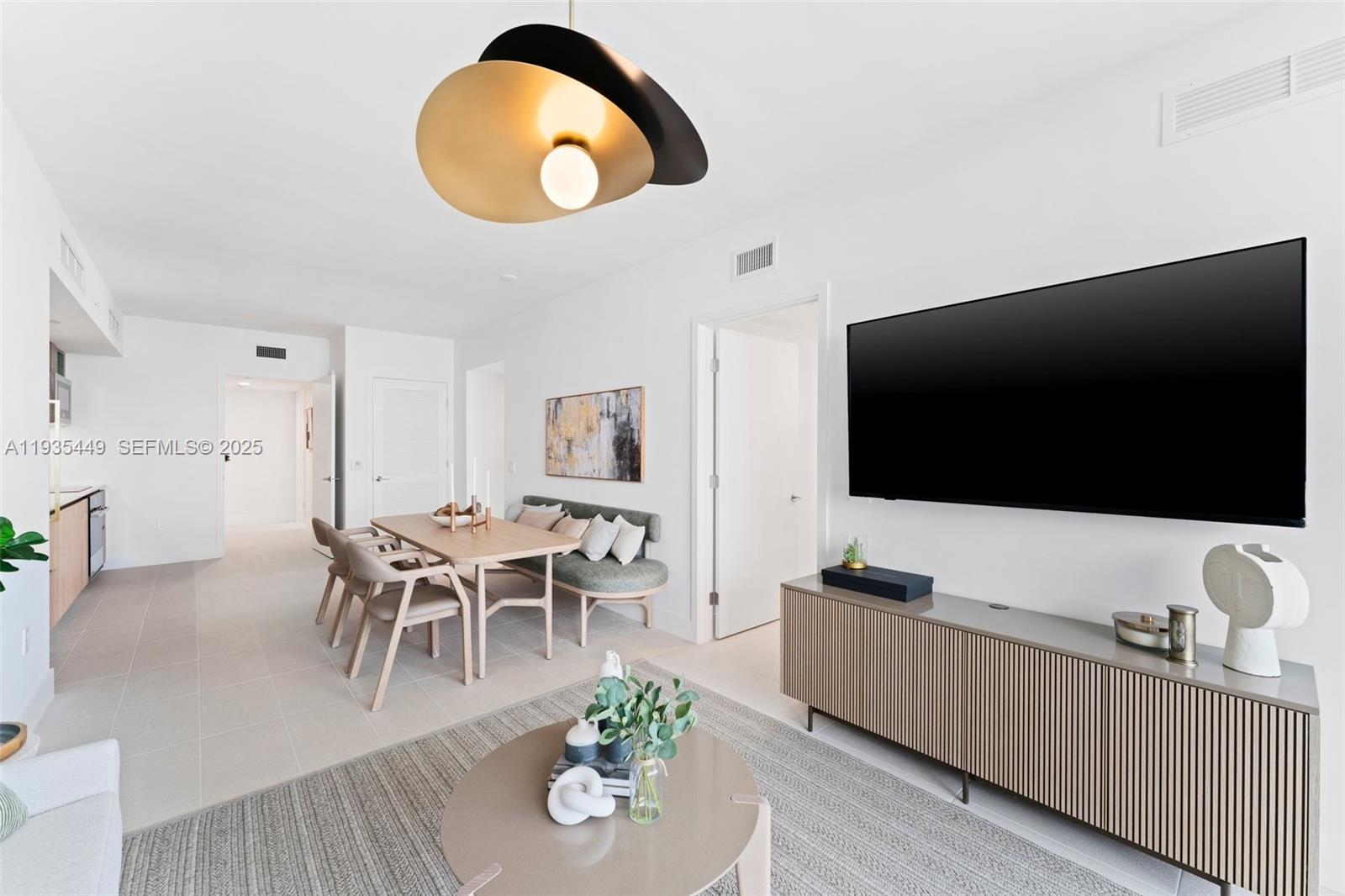 159 Northeast 6th Street, Unit 4415 Miami, FL 33132 - Photo 24 of 47 a living room with furniture and a flat screen tv