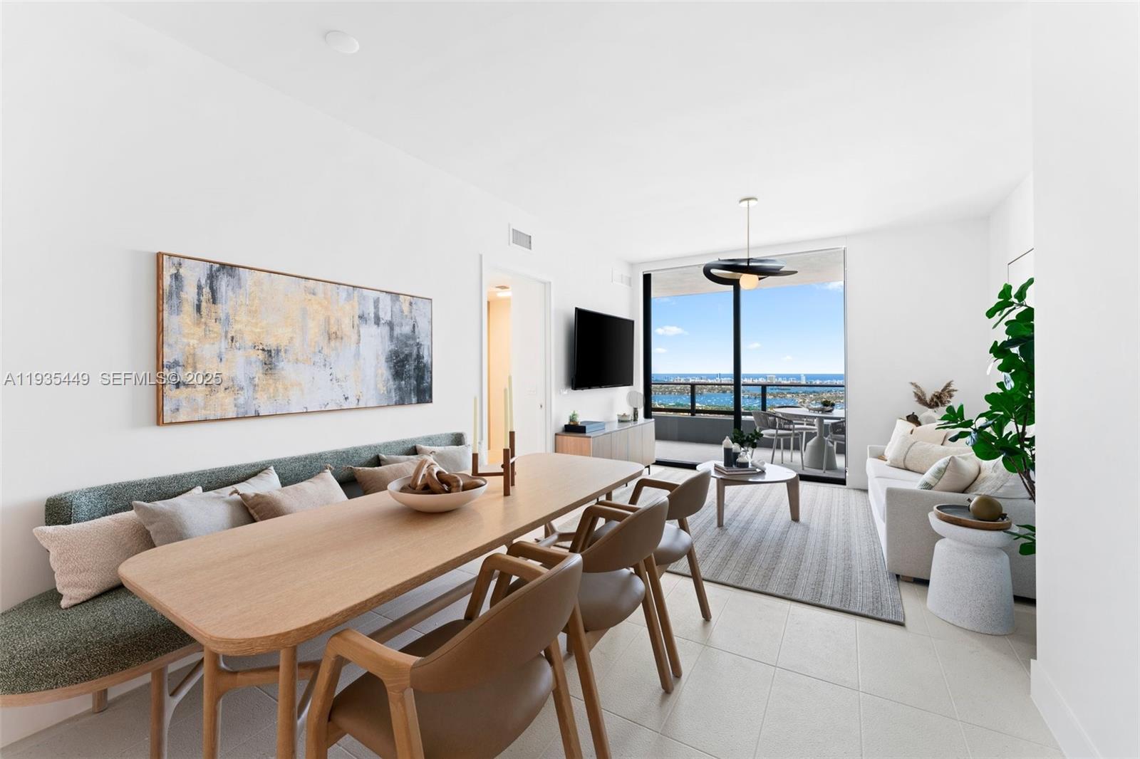 159 Northeast 6th Street, Unit 4415 Miami, FL 33132 - Photo 26 of 47 a view of a dining room with furniture one side kitchen view and wooden floor
