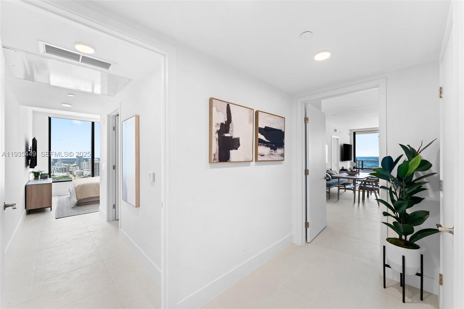159 Northeast 6th Street, Unit 4415 Miami, FL 33132 - Photo 31 of 47 a living room with furniture and potted plant