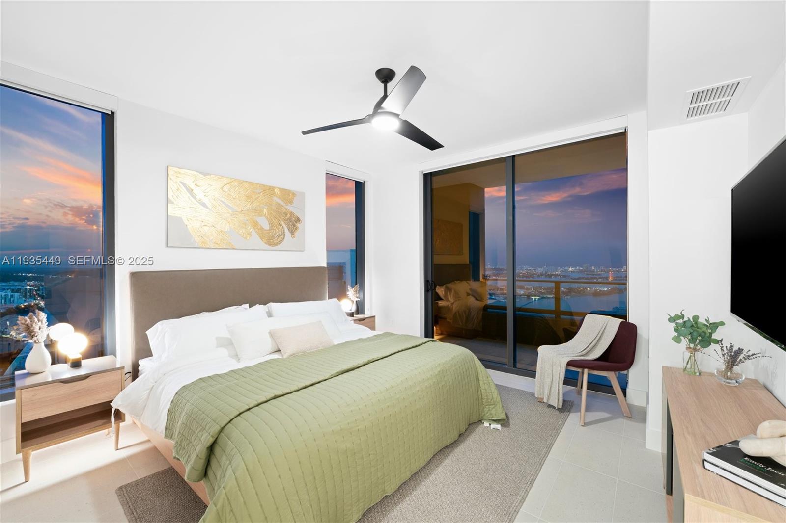 159 Northeast 6th Street, Unit 4415 Miami, FL 33132 - Photo 8 of 47 a bedroom with a bed and a chandelier