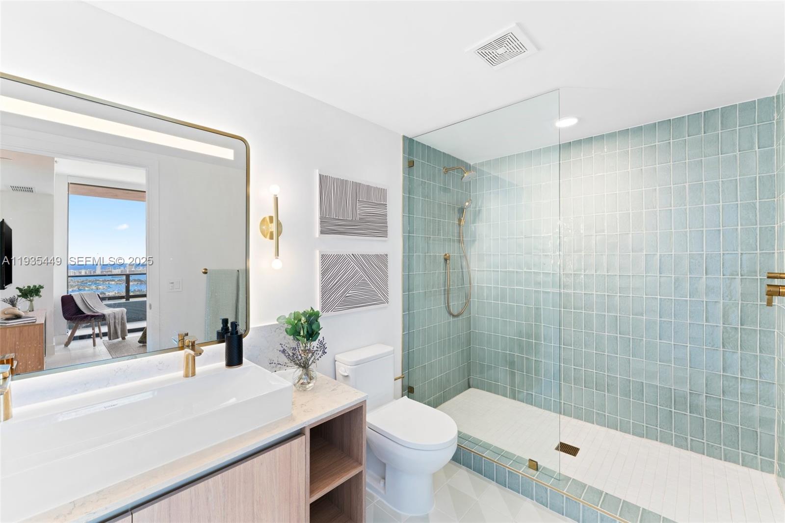 159 Northeast 6th Street, Unit 4415 Miami, FL 33132 - Photo 10 of 47 a bathroom with a sink a toilet and shower