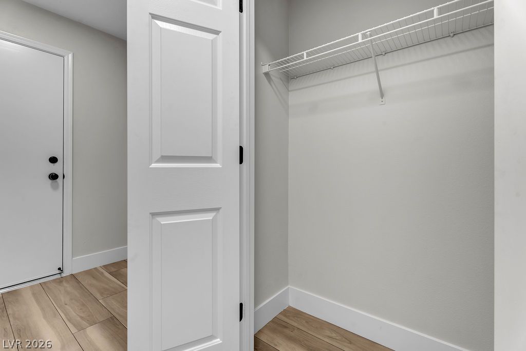 2139 Chapman Ranch Drive Henderson, NV 89012 - Photo 31 of 58 An organized closet with wire shelving and natural wood-look flooring.