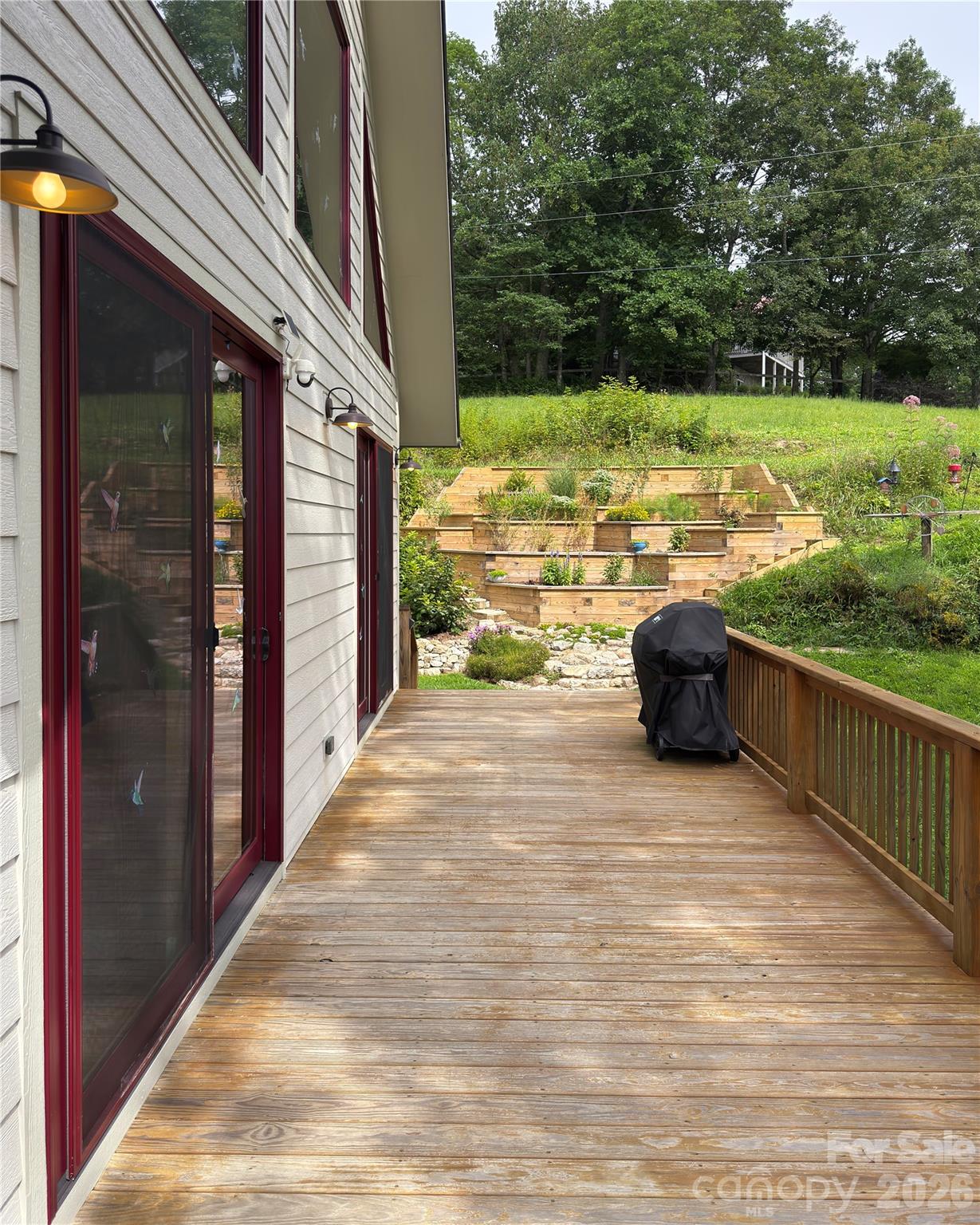 1856 Cabbage Patch Road Burnsville, NC 28714 - Photo 11 of 46 a view of a balcony with floor to ceiling window and yard