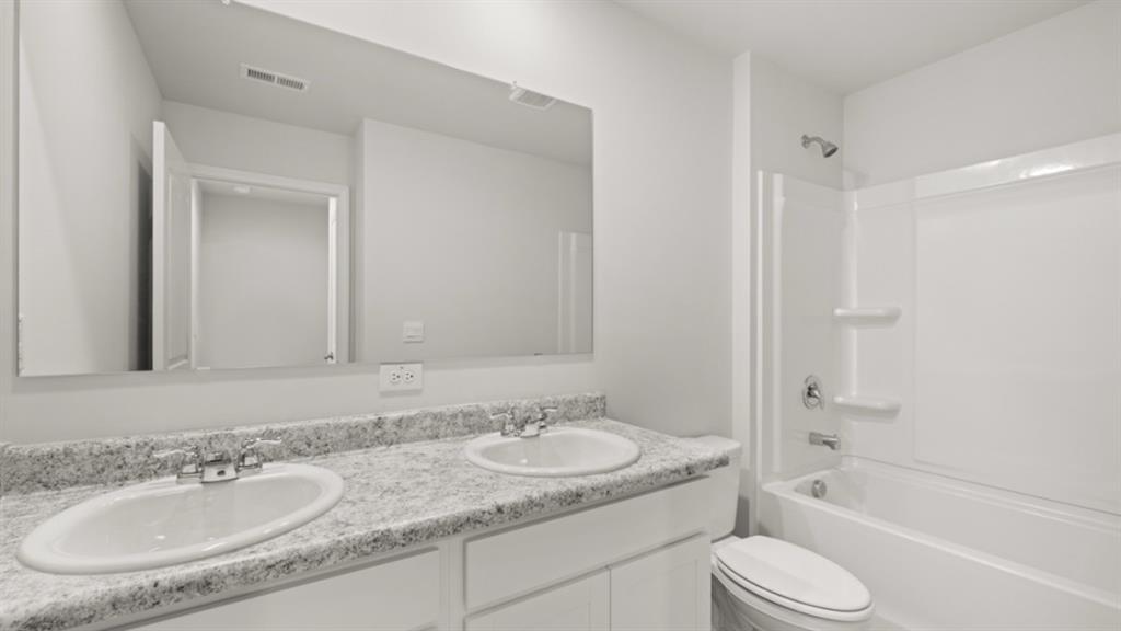 519 Oak View Lane Dallas, GA 30157 - Photo 29 of 35 a bathroom with a granite countertop sink toilet and shower