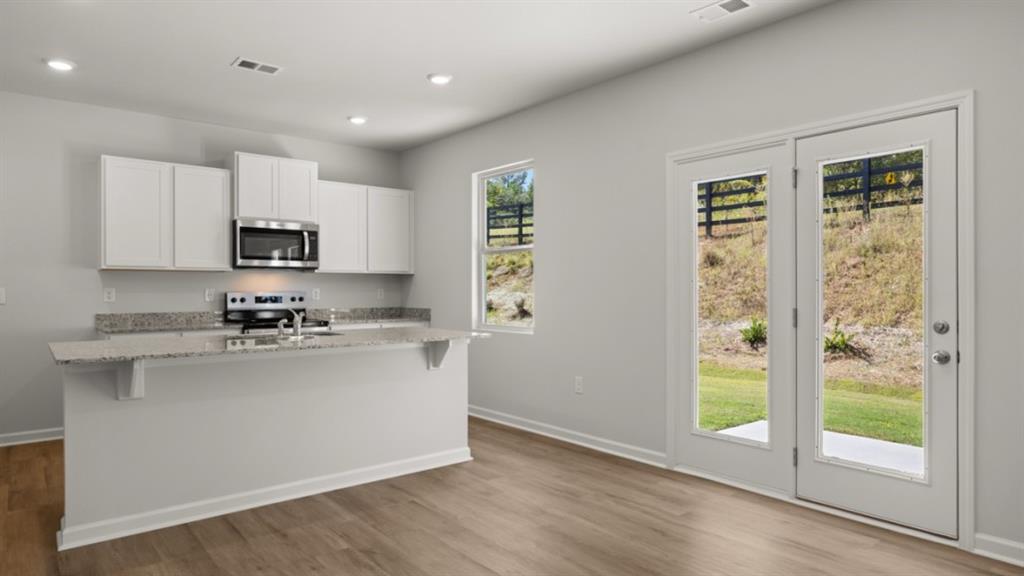 519 Oak View Lane Dallas, GA 30157 - Photo 5 of 35 a kitchen with a sink a stove and cabinets