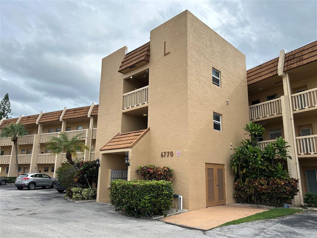 6770 Royal Palm Boulevard, Unit 301L Margate, FL 33063 - Photo 1 of 32 a front view of a building