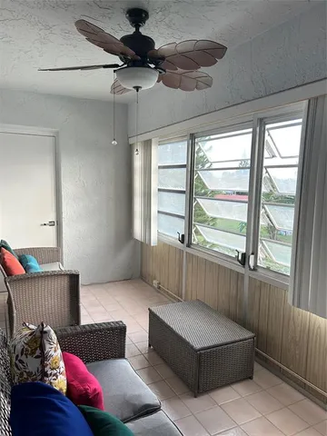 a living room with furniture and a window