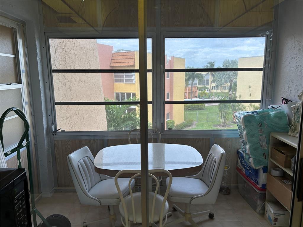 6770 Royal Palm Boulevard, Unit 301L Margate, FL 33063 - Photo 12 of 32 a view of a dining room with furniture window and outside view