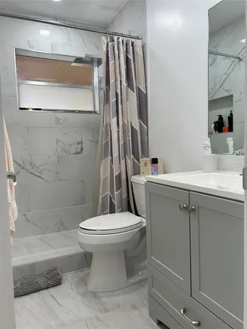 a view of a swimming pool with outdoor seating