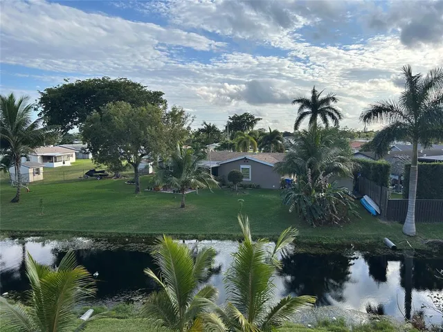 a view of a garden with a lake