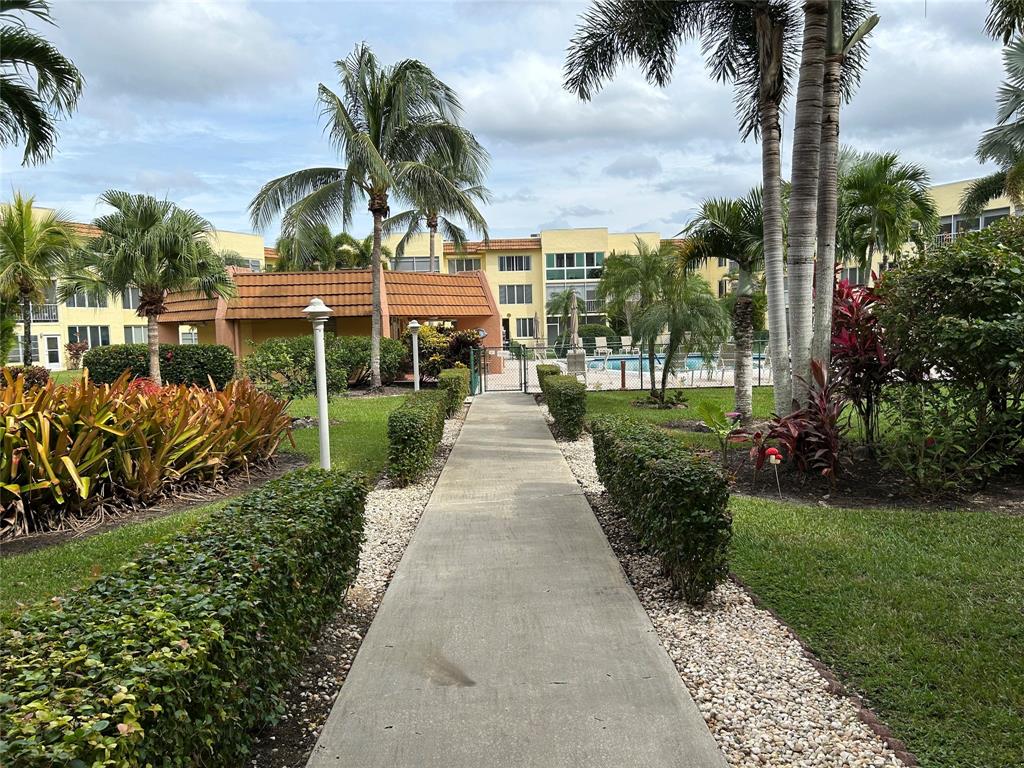 6770 Royal Palm Boulevard, Unit 301L Margate, FL 33063 - Photo 25 of 32 a picture of houses with outdoor space