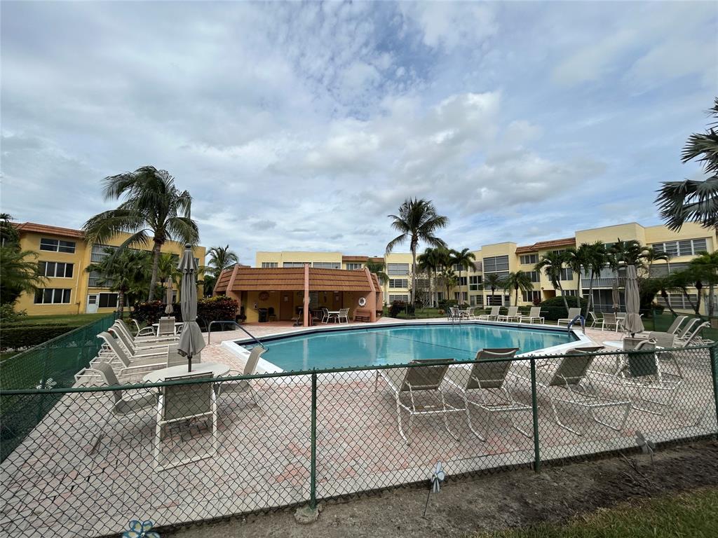 6770 Royal Palm Boulevard, Unit 301L Margate, FL 33063 - Photo 26 of 32 an outdoor space with seating