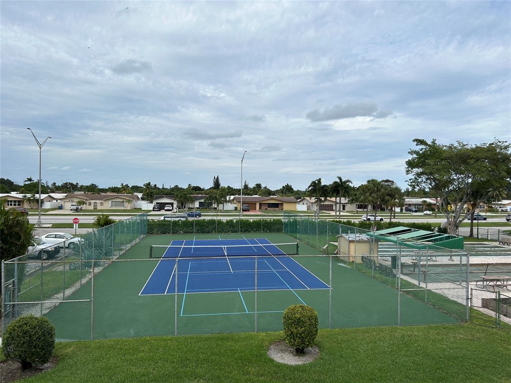 6770 Royal Palm Boulevard, Unit 301L Margate, FL 33063 - Photo 27 of 32 a view of a lake with a houses
