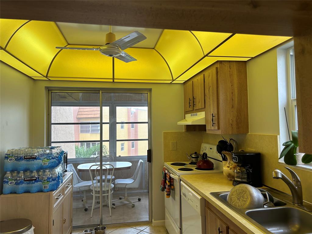 6770 Royal Palm Boulevard, Unit 301L Margate, FL 33063 - Photo 8 of 32 a view of a dining room with furniture and a window