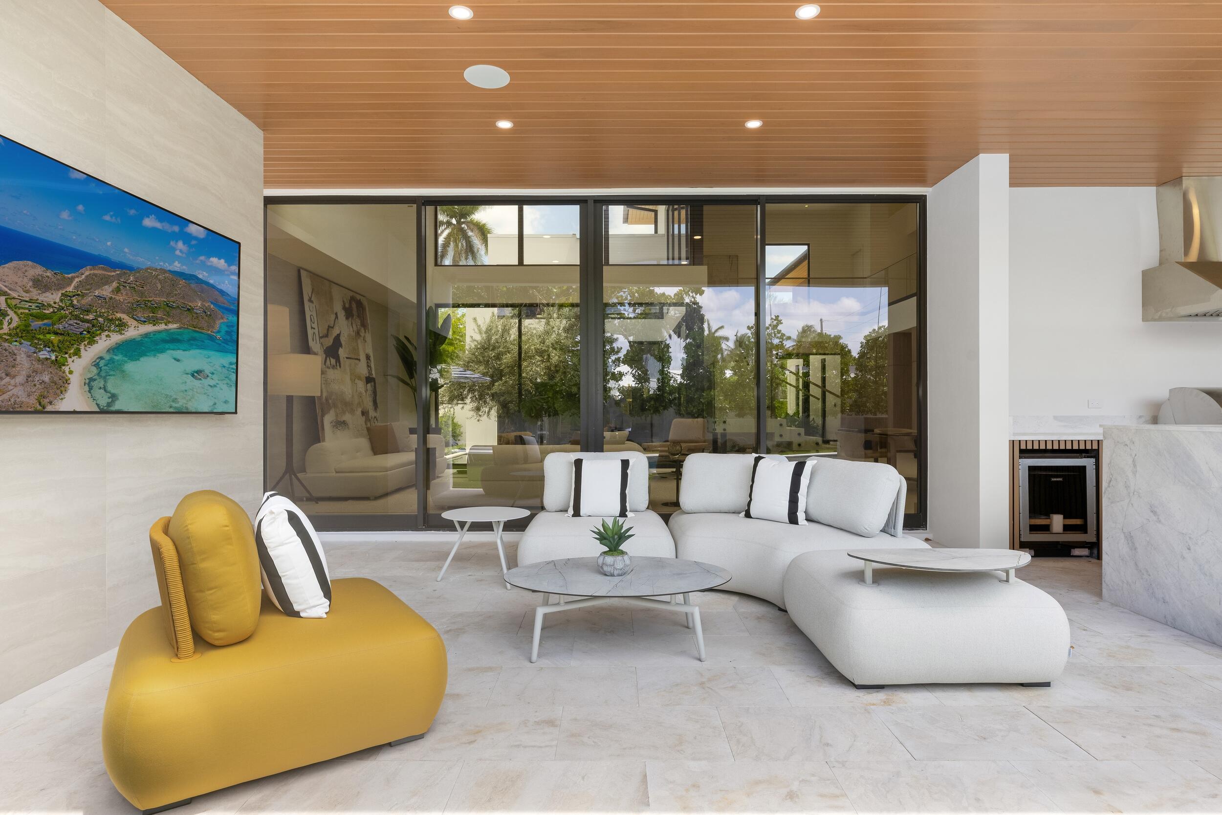 1351 Cocoanut Road Boca Raton, FL 33432 - Photo 51 of 101 a living room with furniture and a floor to ceiling window