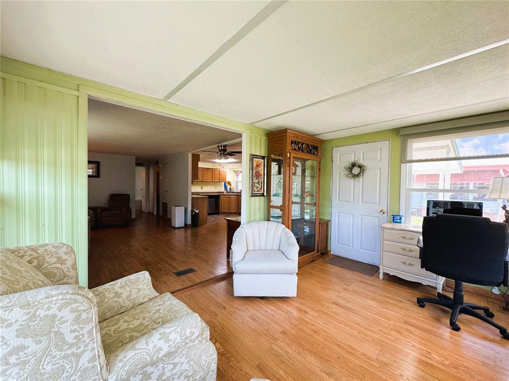 151 Hibiscus Way Leesburg, FL 34748 - Photo 14 of 30 a living room with furniture and a window
