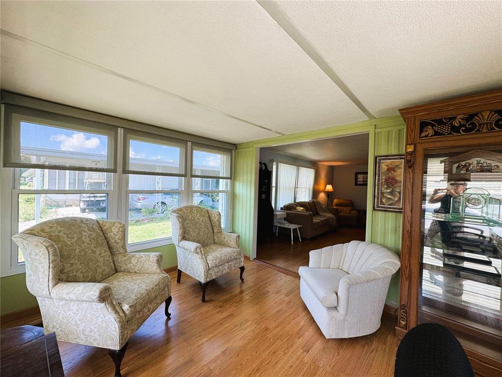 151 Hibiscus Way Leesburg, FL 34748 - Photo 15 of 30 a living room with furniture and a large window