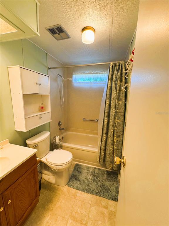 151 Hibiscus Way Leesburg, FL 34748 - Photo 18 of 30 a bathroom with a sink toilet and shower