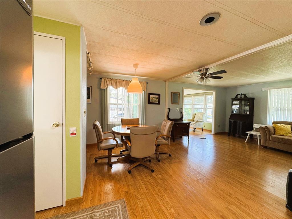 151 Hibiscus Way Leesburg, FL 34748 - Photo 7 of 30 a living room with furniture and a wooden floor