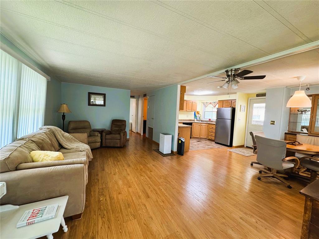 151 Hibiscus Way Leesburg, FL 34748 - Photo 9 of 30 a living room with furniture and a wooden floor