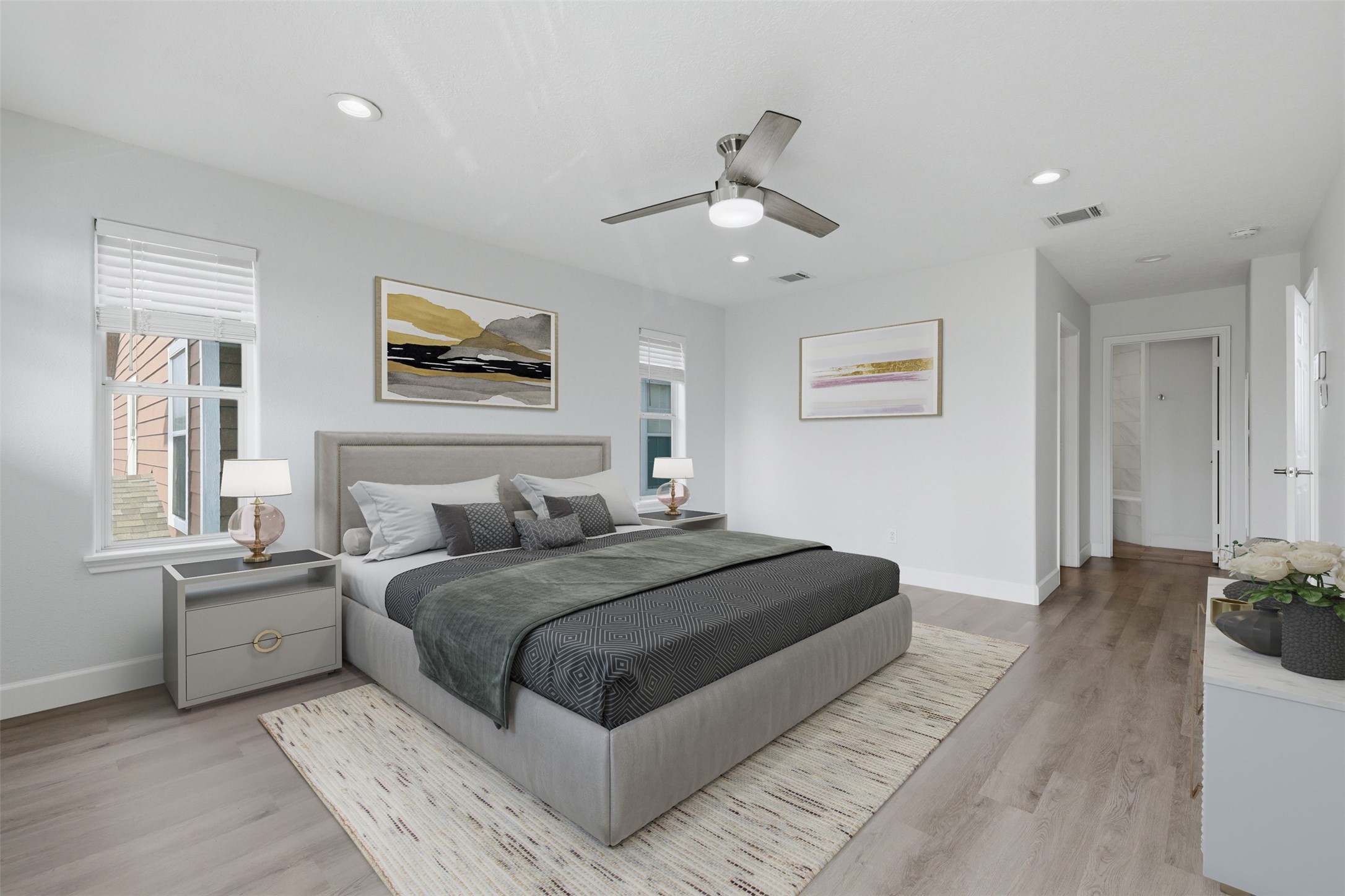 9026 McGallion Road Houston, TX 77022 - Photo 16 of 32 a bedroom with a large bed and a chandelier