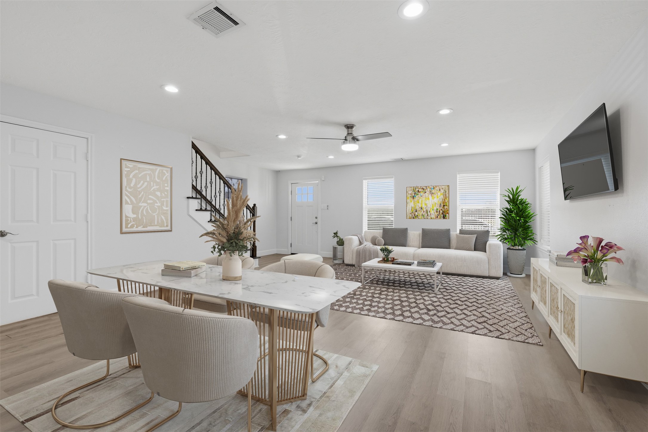 9026 McGallion Road Houston, TX 77022 - Photo 7 of 32 a living room with furniture a flat screen tv and a table