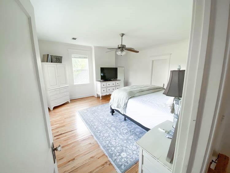 581 Country Club Road Fairview, TX 75069 - Photo 29 of 39 a bedroom with a bed and wooden floor