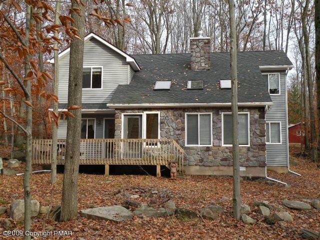 164 Elk Run Road Pocono Lake, PA 18347 - Photo 1 of 11 a front view of a house with a yard