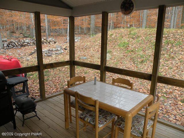 164 Elk Run Road Pocono Lake, PA 18347 - Photo 11 of 11 a view of a living room with furniture and a window