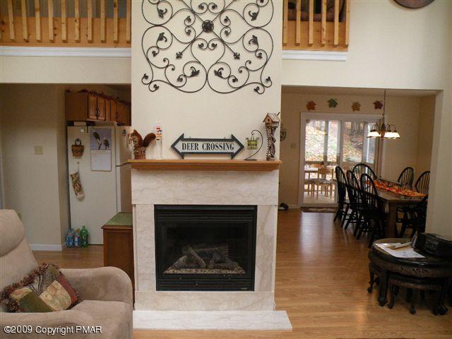 164 Elk Run Road Pocono Lake, PA 18347 - Photo 3 of 11 a living room with furniture and a fireplace